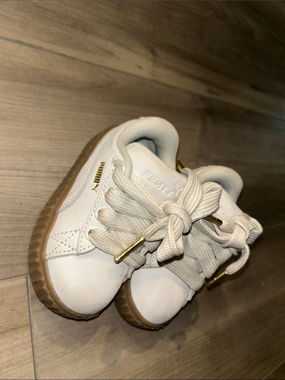 Puma Kids White Sneakers with Gum Sole and Gold Accents